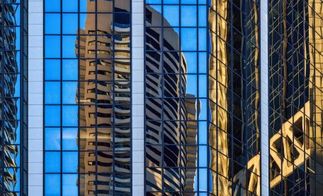 Skyscraper reflections in windows of highrise buildings in Sydney