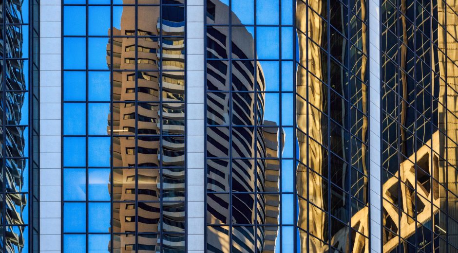 Skyscraper reflections in windows of highrise buildings in Sydney